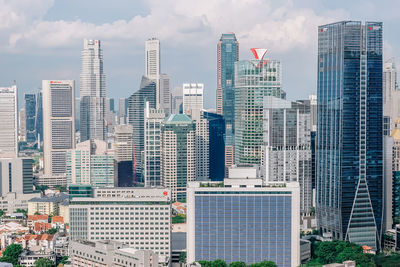 Modern buildings in city against sky