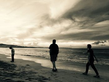 Silhouette of people on beach