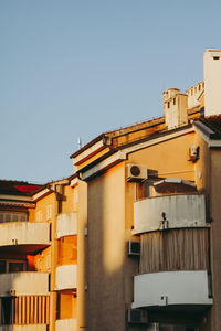 Low angle view of buildings against clear sky