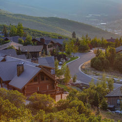 High angle view of road amidst buildings and trees