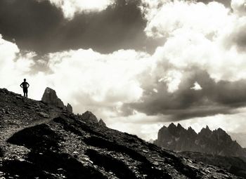Scenic view of mountains against cloudy sky