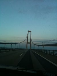 Suspension bridge against blue sky