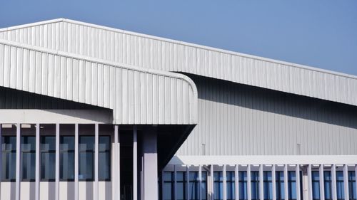 Low angle view of building against clear blue sky