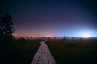 Scenic view of landscape against sky at night