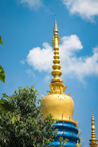 Low angle view of traditional building against blue sky