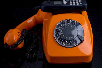 Close-up of telephone booth on table