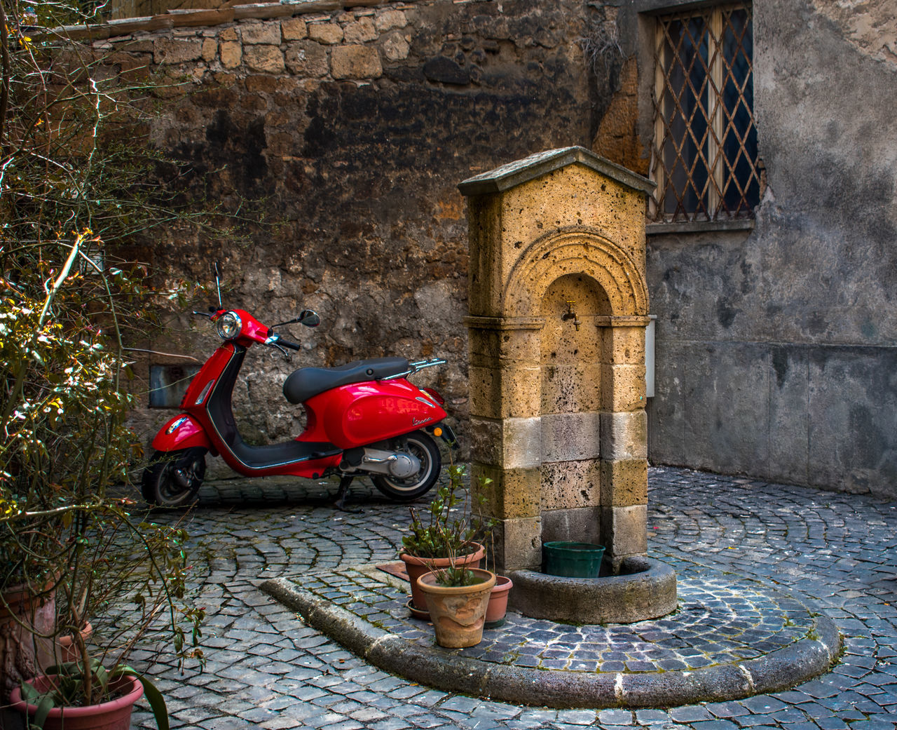 OLD FIRE HYDRANT AGAINST WALL AND BUILDING