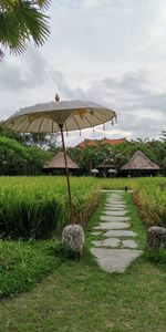 Built structure on grass against sky