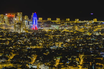 Illuminated buildings in city at night