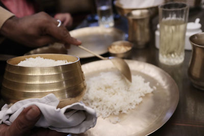 Close-up of person preparing food on table