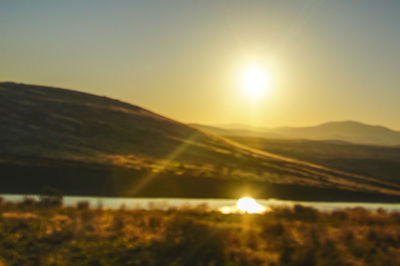 Scenic view of landscape against sky during sunset