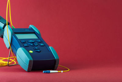 Close-up of usb stick against blue background