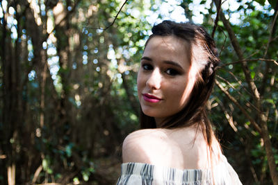 Portrait of beautiful woman in forest