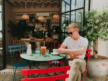 Man sitting on table at restaurant