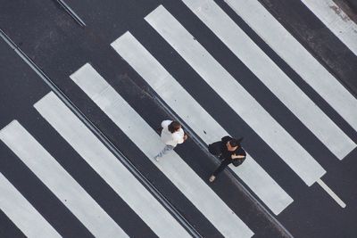 High angle view of women crossing road