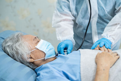 Midsection of man lying on floor