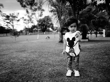 Portrait of boy standing in park