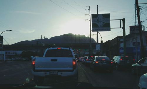 Cars on road against clear sky