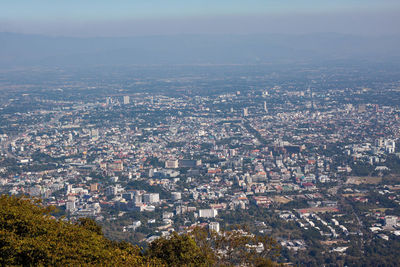 High angle view of illuminated cityscape against sky