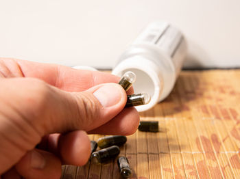 Close-up of hand holding camera