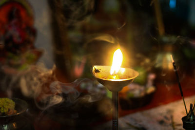 Close-up of lit diya