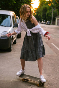 Full length of woman standing on street