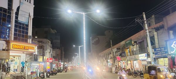 Illuminated city street at night