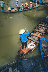 High angle view of men fishing in river