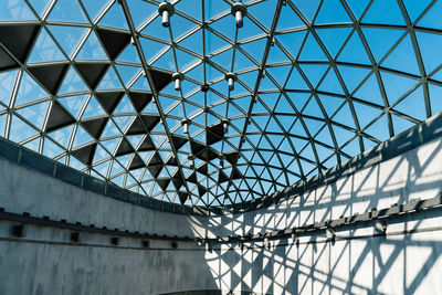 Low angle view of patterned ceiling on sunny day