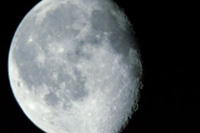 Close-up of moon over black background