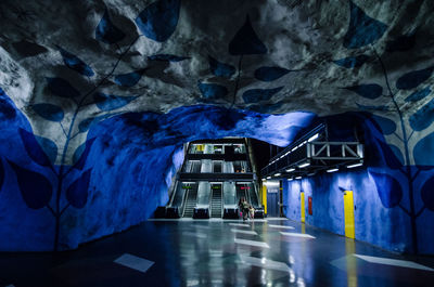 Illuminated subway train at night