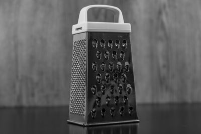 Close-up of grater on table