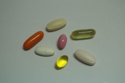 High angle view of multi colored pencils on white background