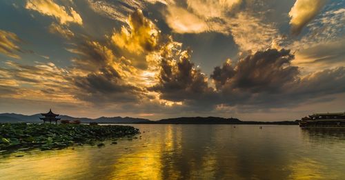 Panoramic view of sea against sky during sunset