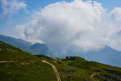 Clouds over the peaks of the alps on lake garda in the province of verona, italy