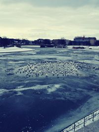 Scenic view of frozen lake against sky