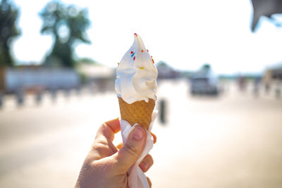 Hand holding ice cream cone