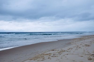 Scenic view of beach against sky