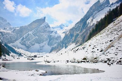 Scenic view of mountains against sky during winter