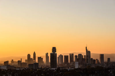 View of cityscape against clear sky during sunset