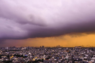 High angle view of city at sunset