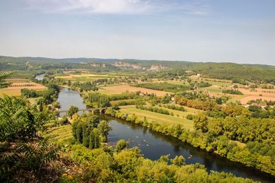 Scenic view of river amidst landscape against sky