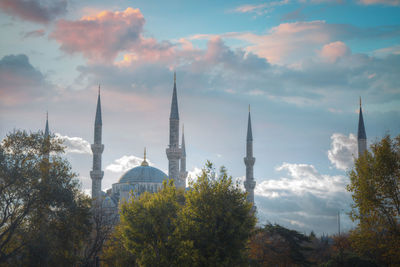 Buildings in city against sky