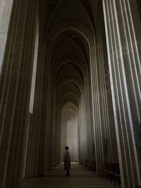 Rear view of man walking in building