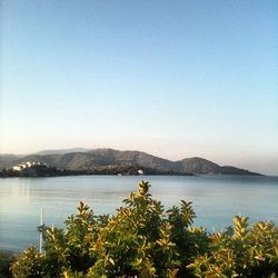 Scenic view of lake with mountains in background