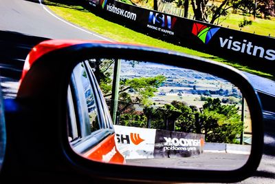 Reflection of car on side-view mirror