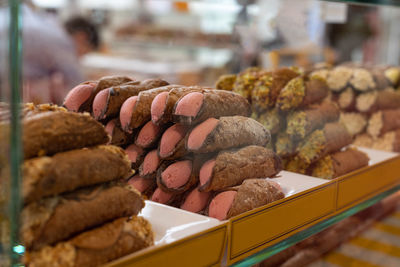 Italian sweet dessert, traditional sicilian cannoli with pink cream flavored with orange.