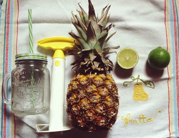 Close-up of fruits in vase on table