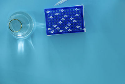 Directly above shot of christmas decoration on blue background