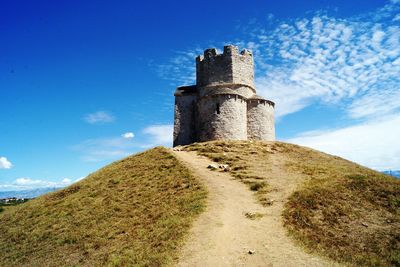 Low angle view of old ruins against sky